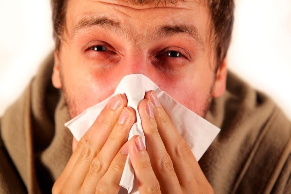 Gentleman blowing his nose